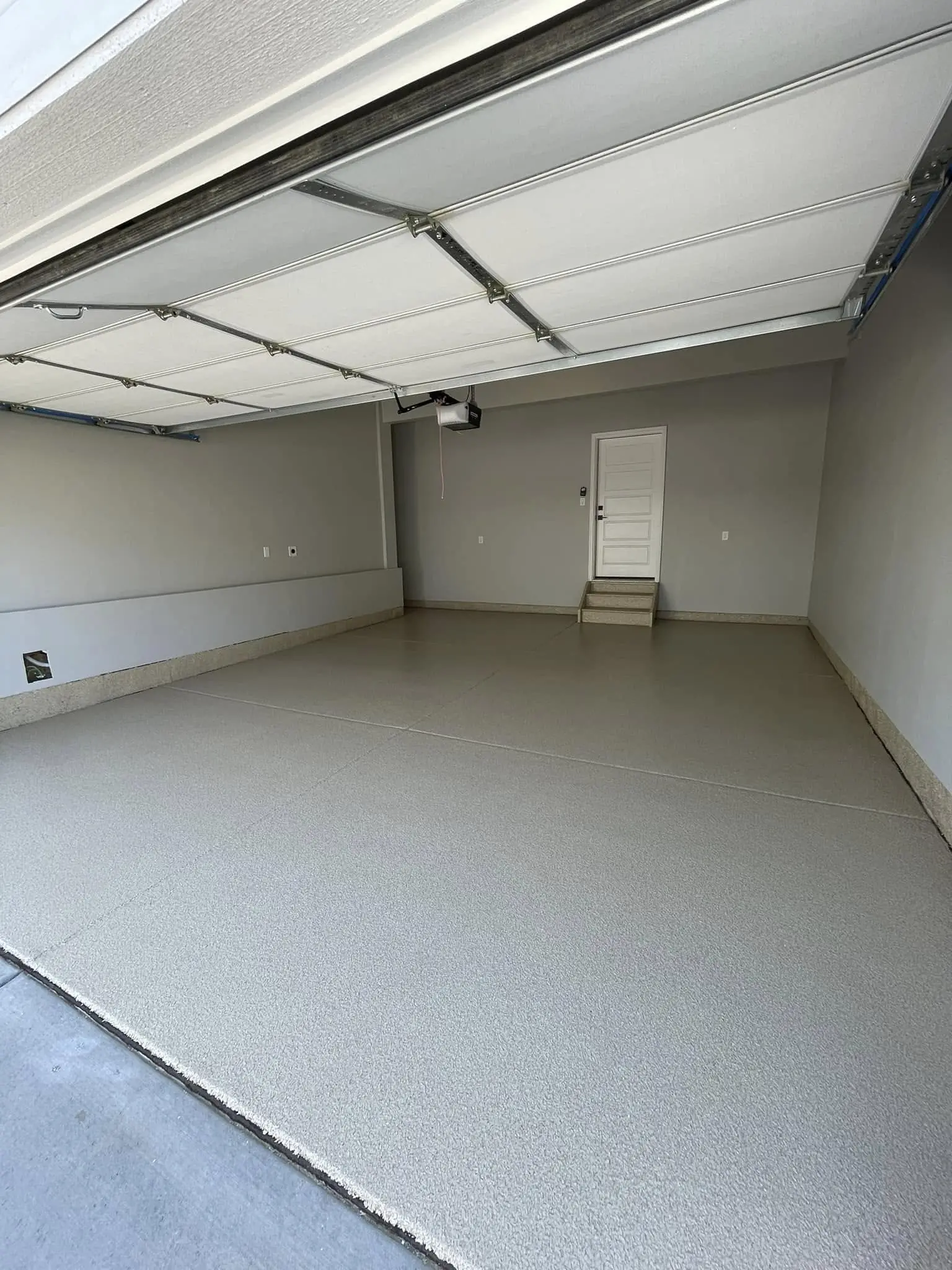 Elevated Epoxy Co installing floor in Denver tattoo studio