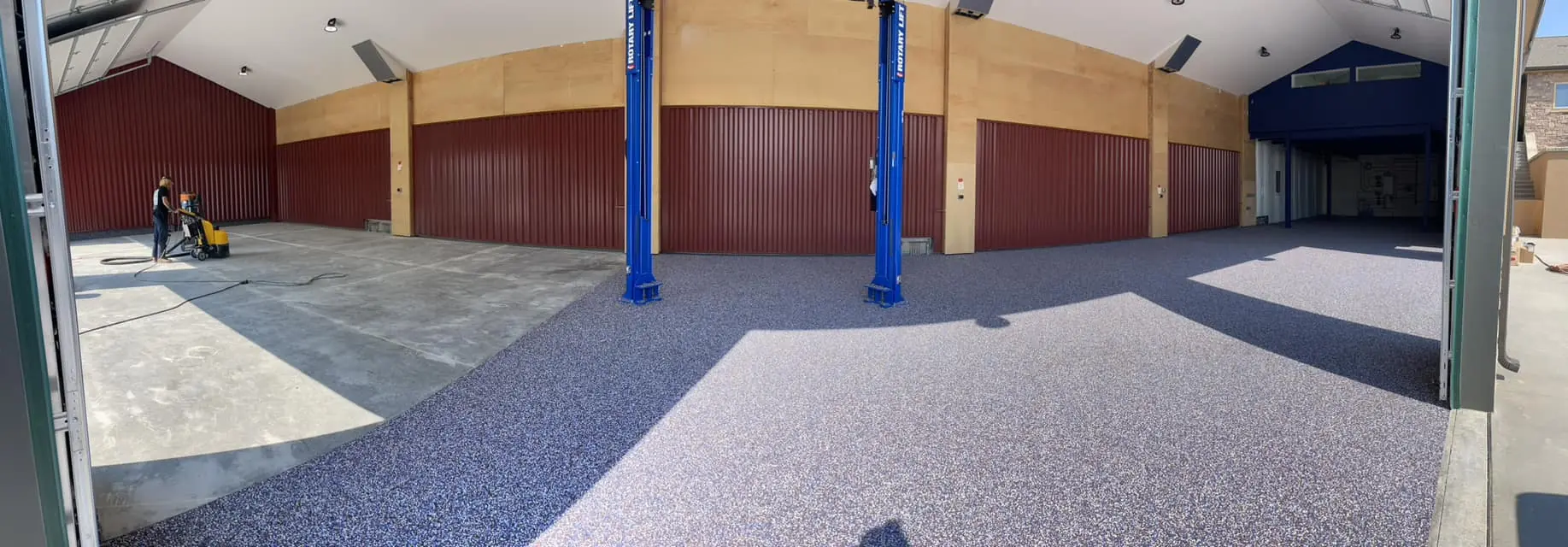 Elevated Epoxy team installing industrial floor coating