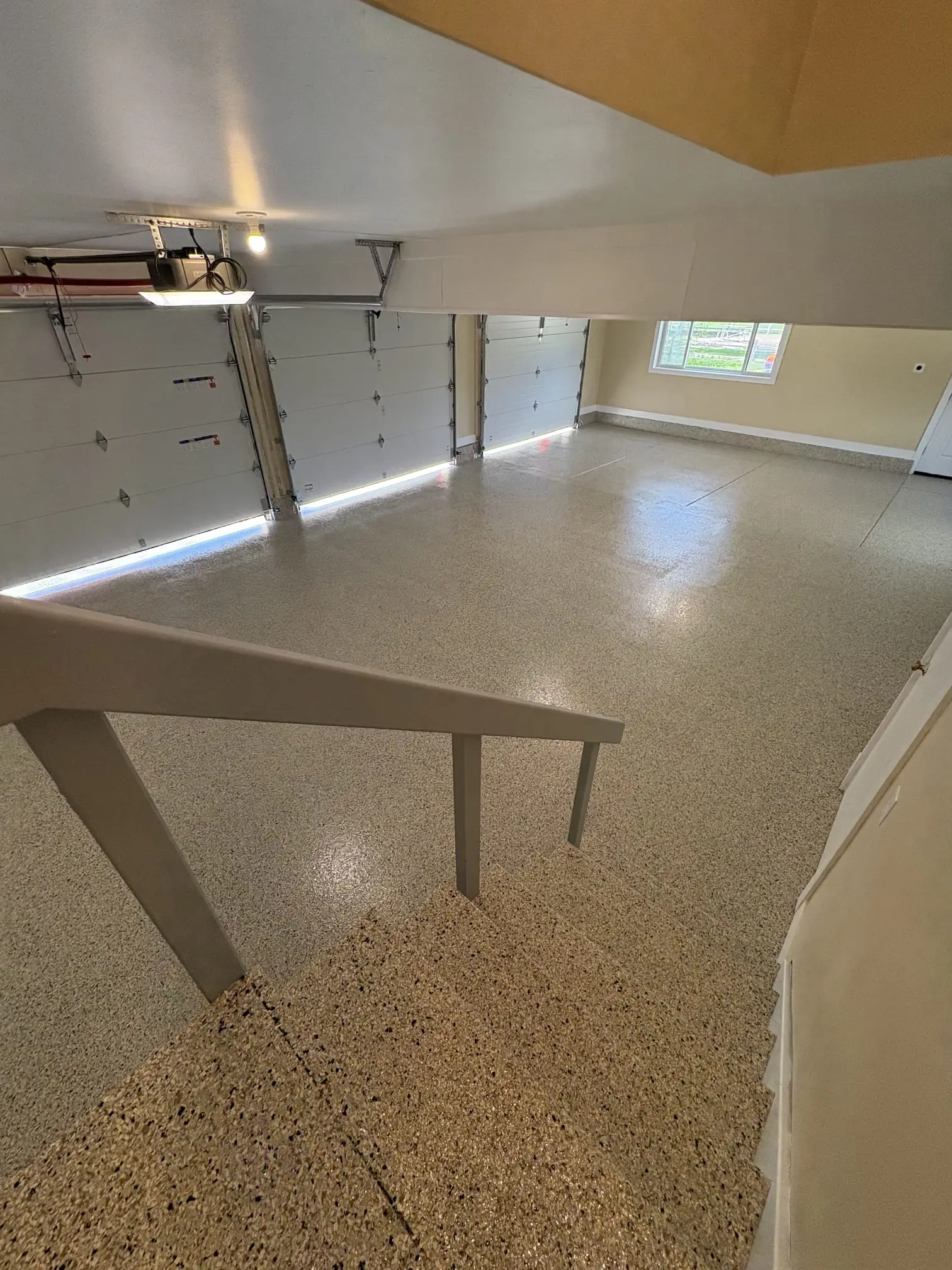 Flake epoxy garage floor transformation in Highlands Ranch by Elevated Epoxy Co