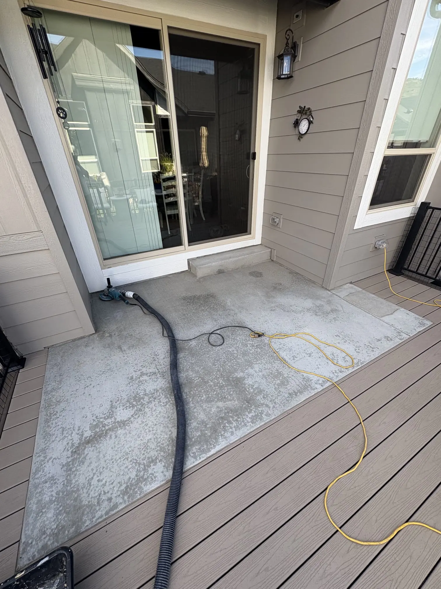 Elevated Epoxy team installing garage floor coating