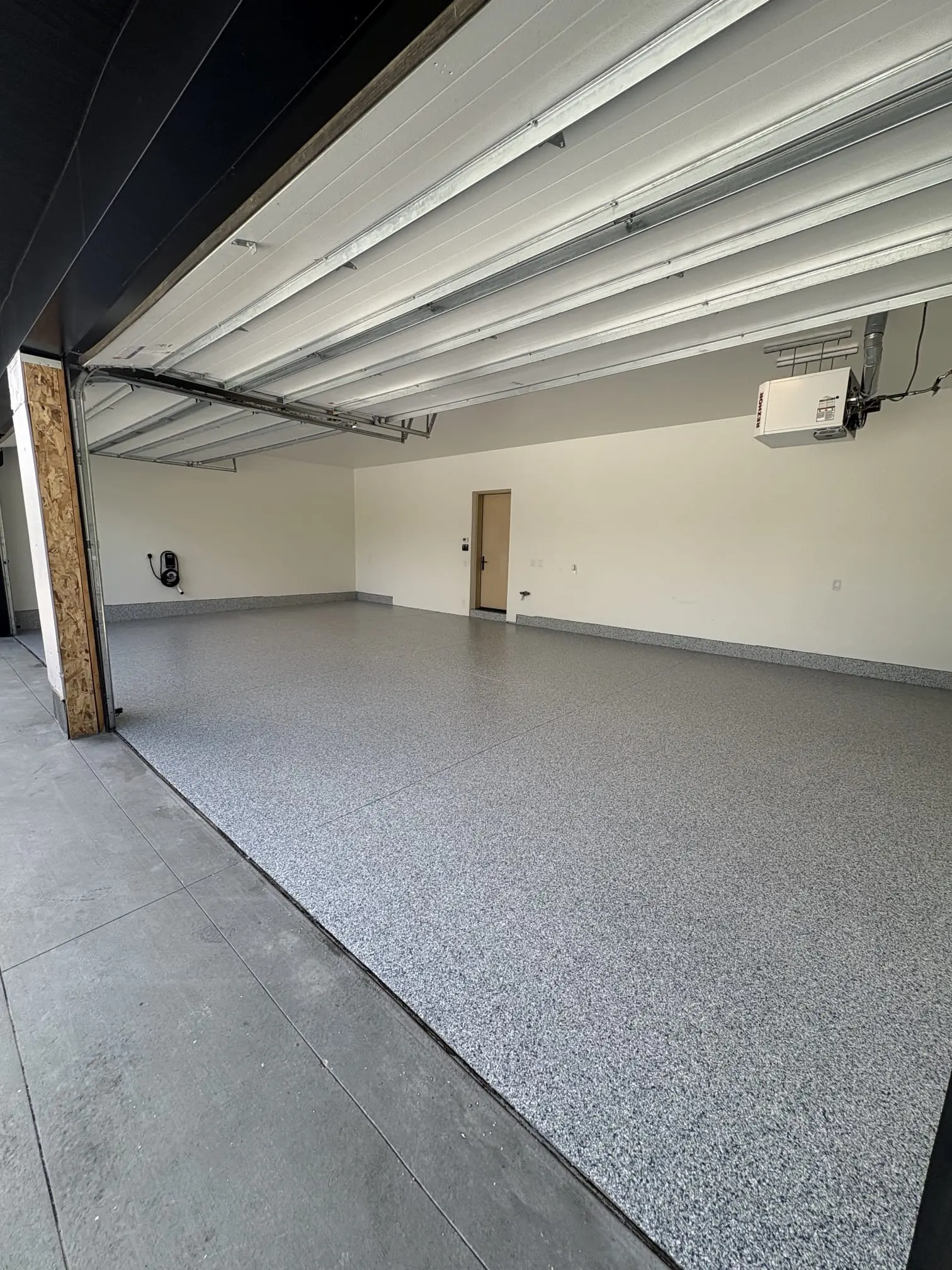 Polished metallic epoxy floor in luxury Mercedes garage build-out, Denver Metro Colorado