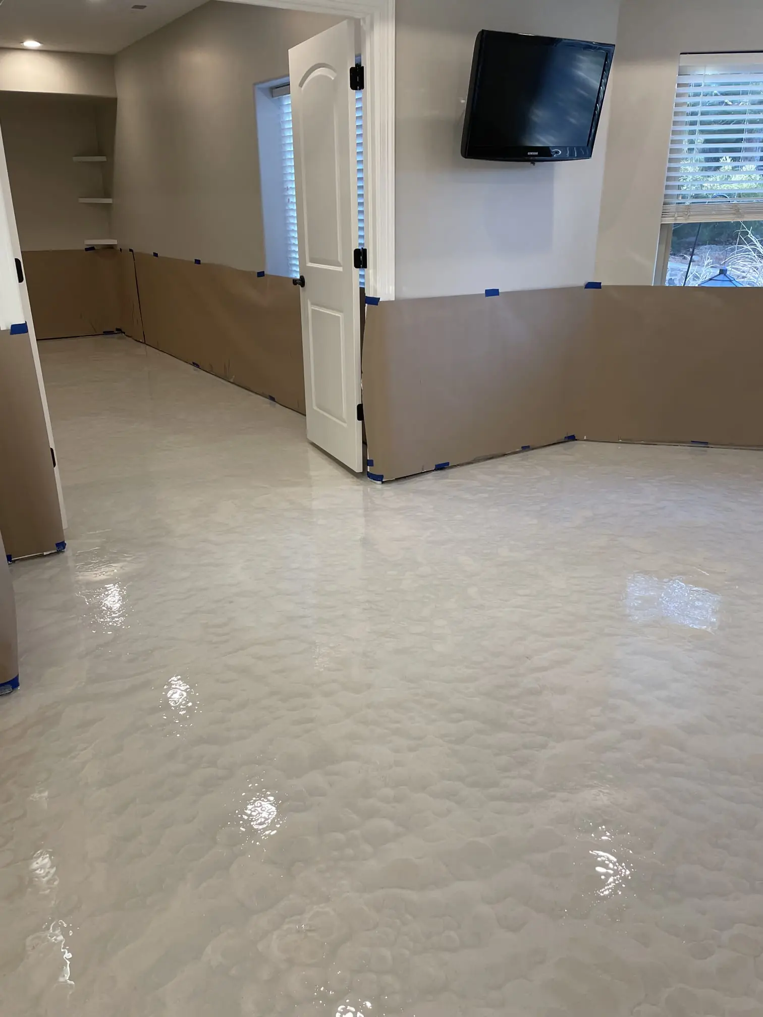 Metallic epoxy flooring installation in Thornton Colorado garage