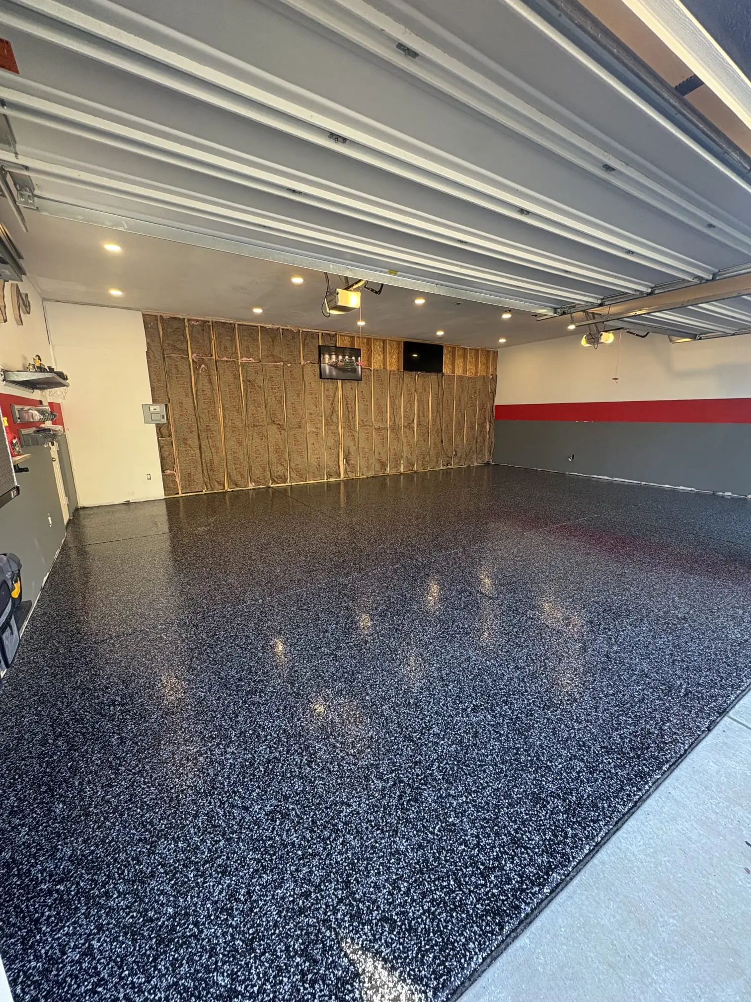 Gray flake epoxy garage floor with red accent stripe, Denver Metro Colorado