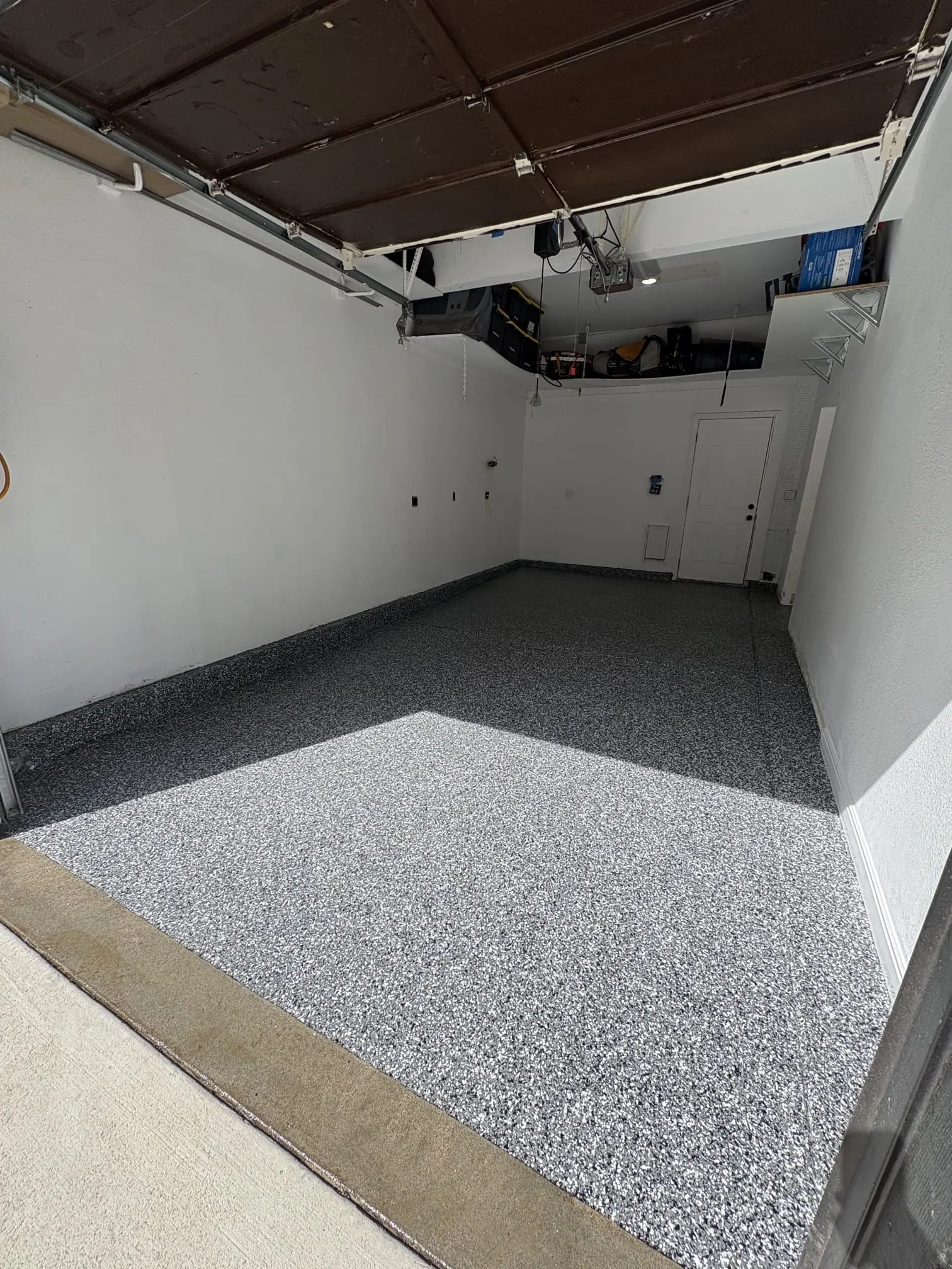 Flake epoxy floor in professional auto shop with lift equipment, Denver Metro Colorado