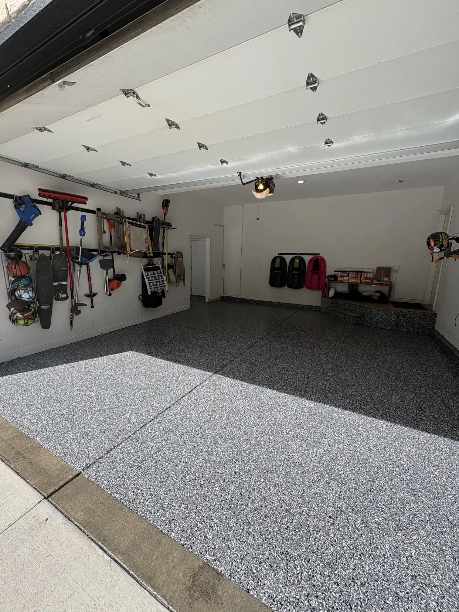 Seamless epoxy gym floor compared to rubber tile installation in Denver